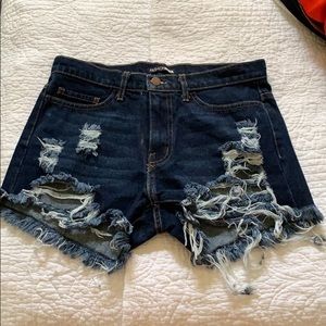 Distressed dark blue denim shorts
